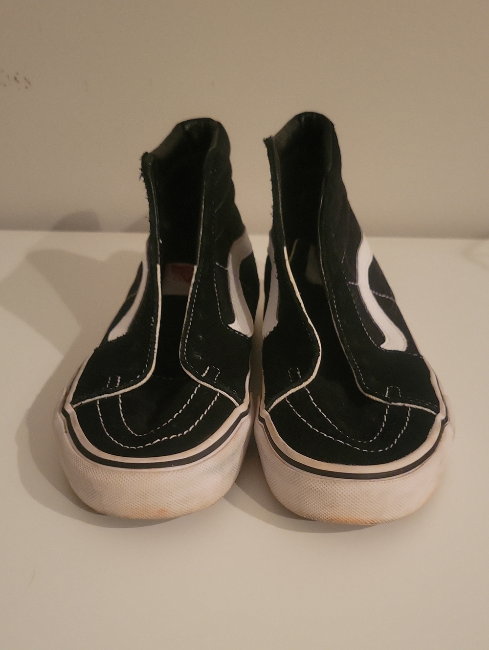 Vans Black and White High-Top Slip-On Sneakers